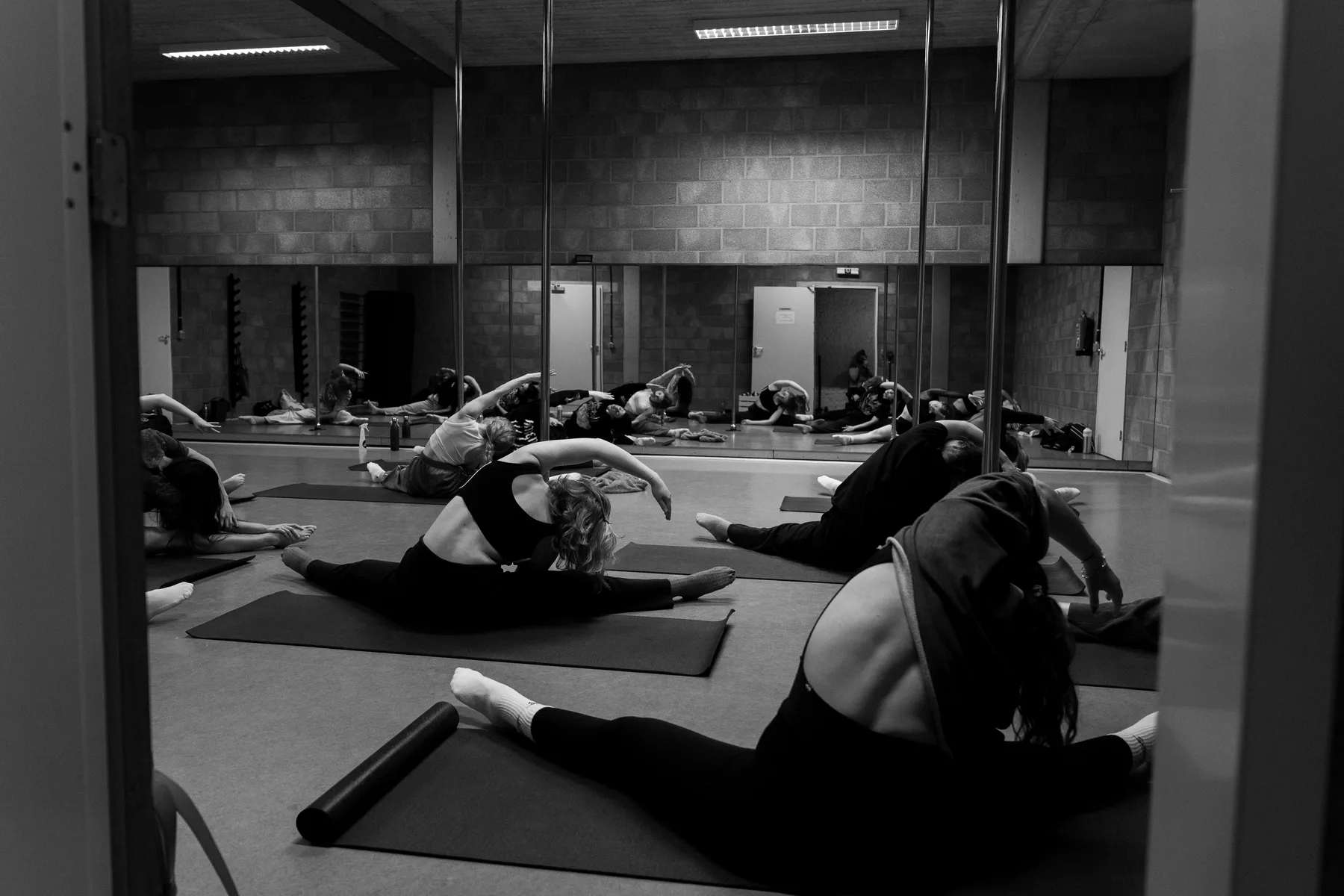 A group stretching together during class